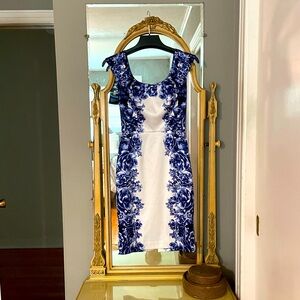 Blue and white, satin, floral cocktail dress with split in back.